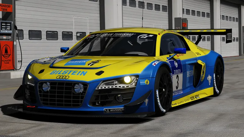 Audi R8 LMS Ultra in red and black livery on track